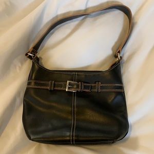 Black bag with brown stitching and buckle